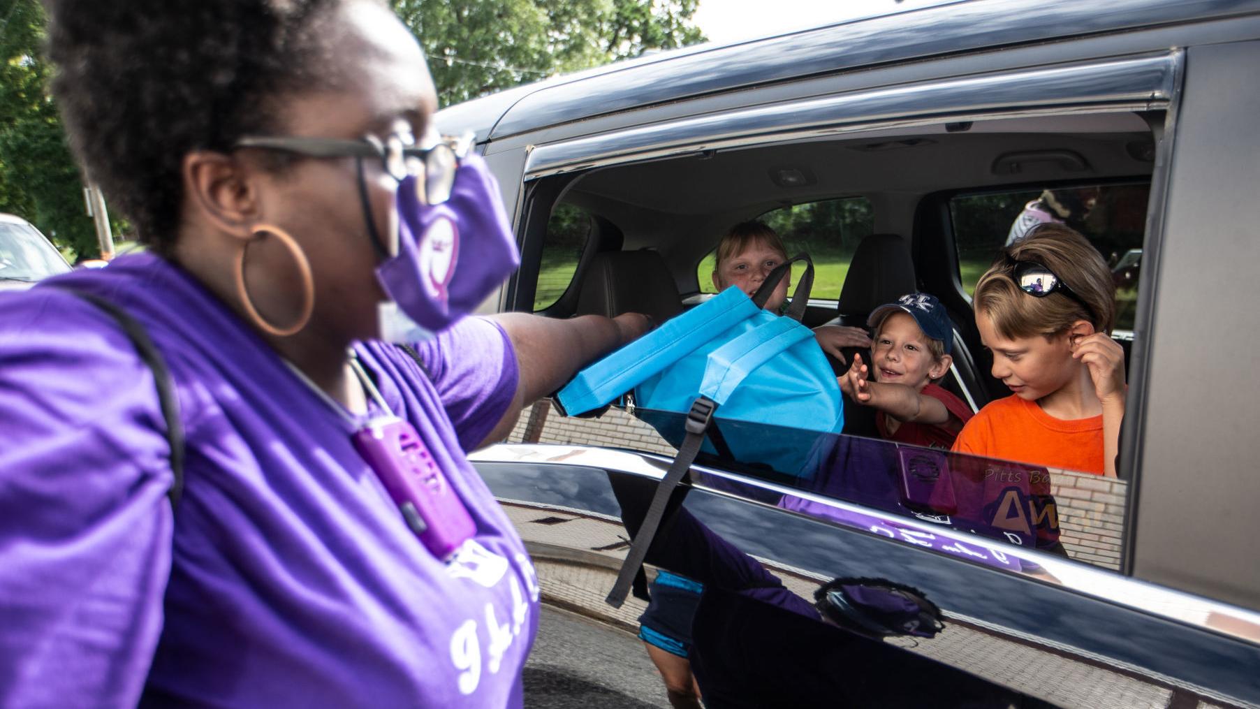 Photos: Nonprofit gives out backpacks full of school supplies